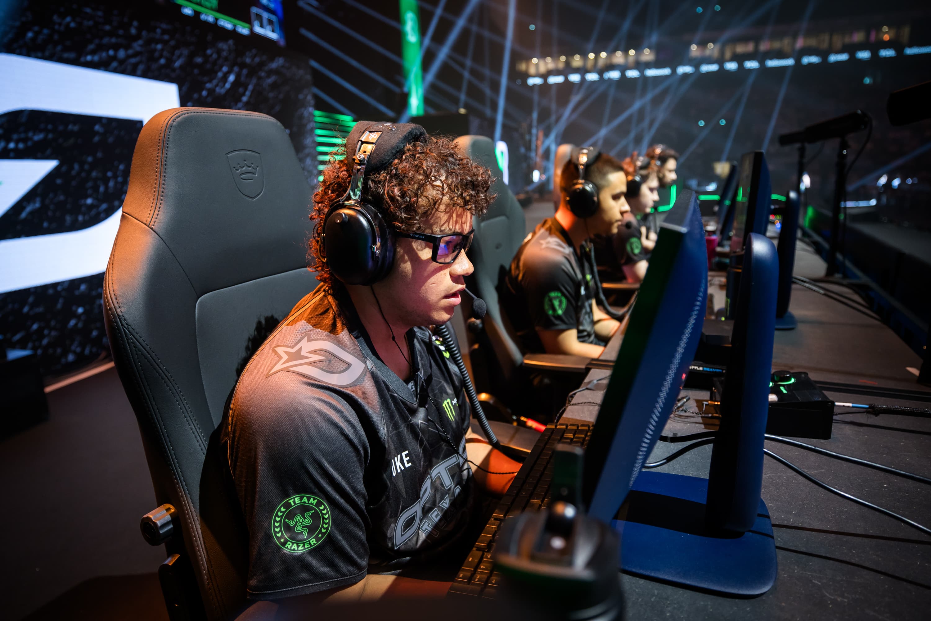 Players competing together at a live esports event